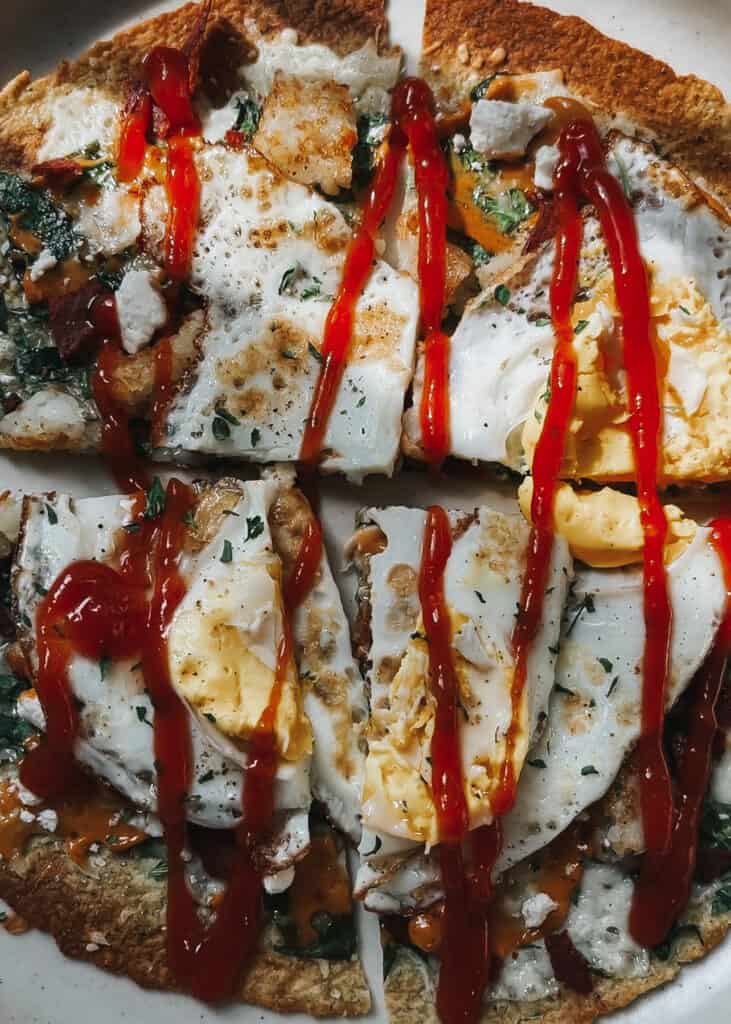 breakfast pizza with ketchup drizzle