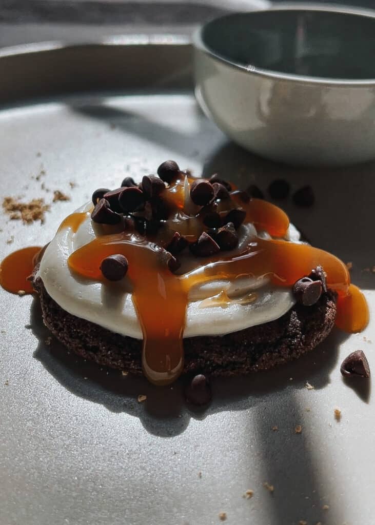 chocolate cookie with icing and caramel