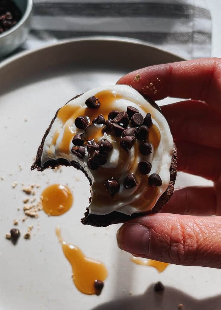 hold a chocolate chip caramel cookie