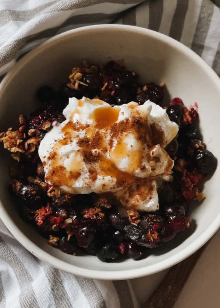 blueberry crisp with cool whip and caramel