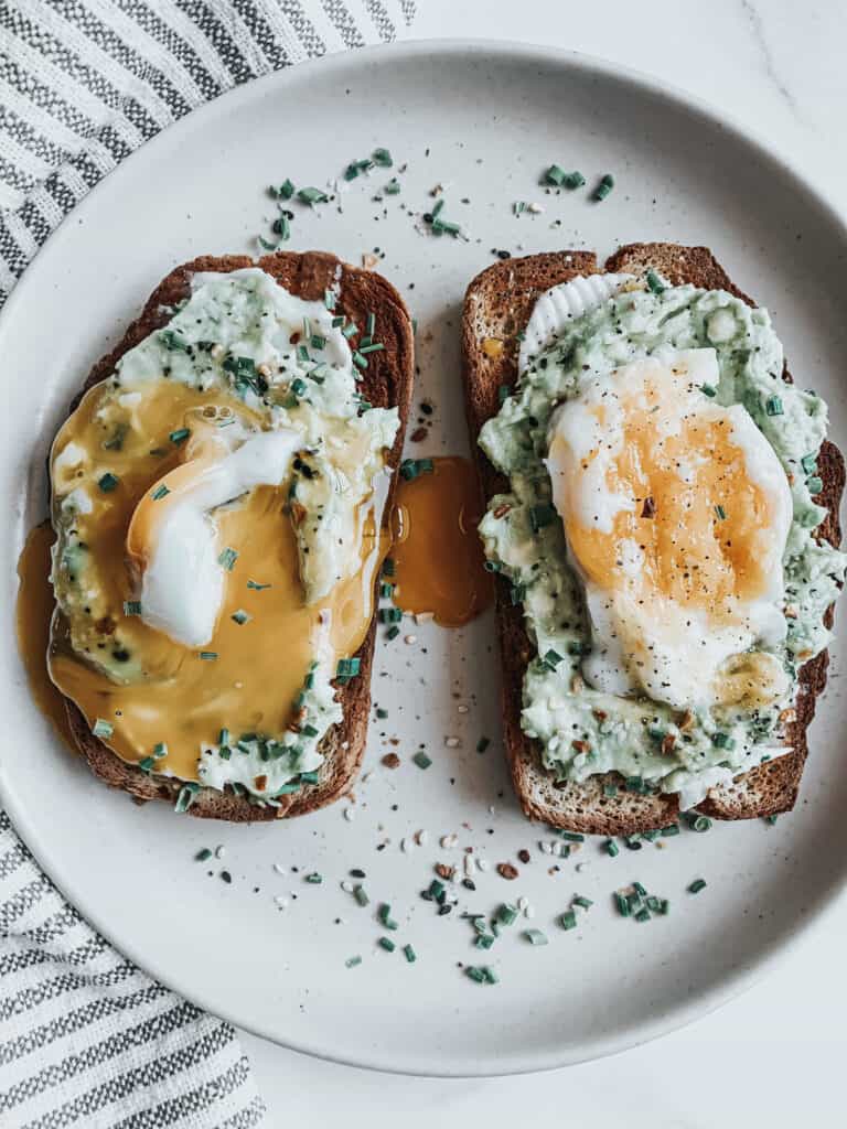 Dill cream cheese and slice avocado toast with a poached egg￼ - bon abbetit