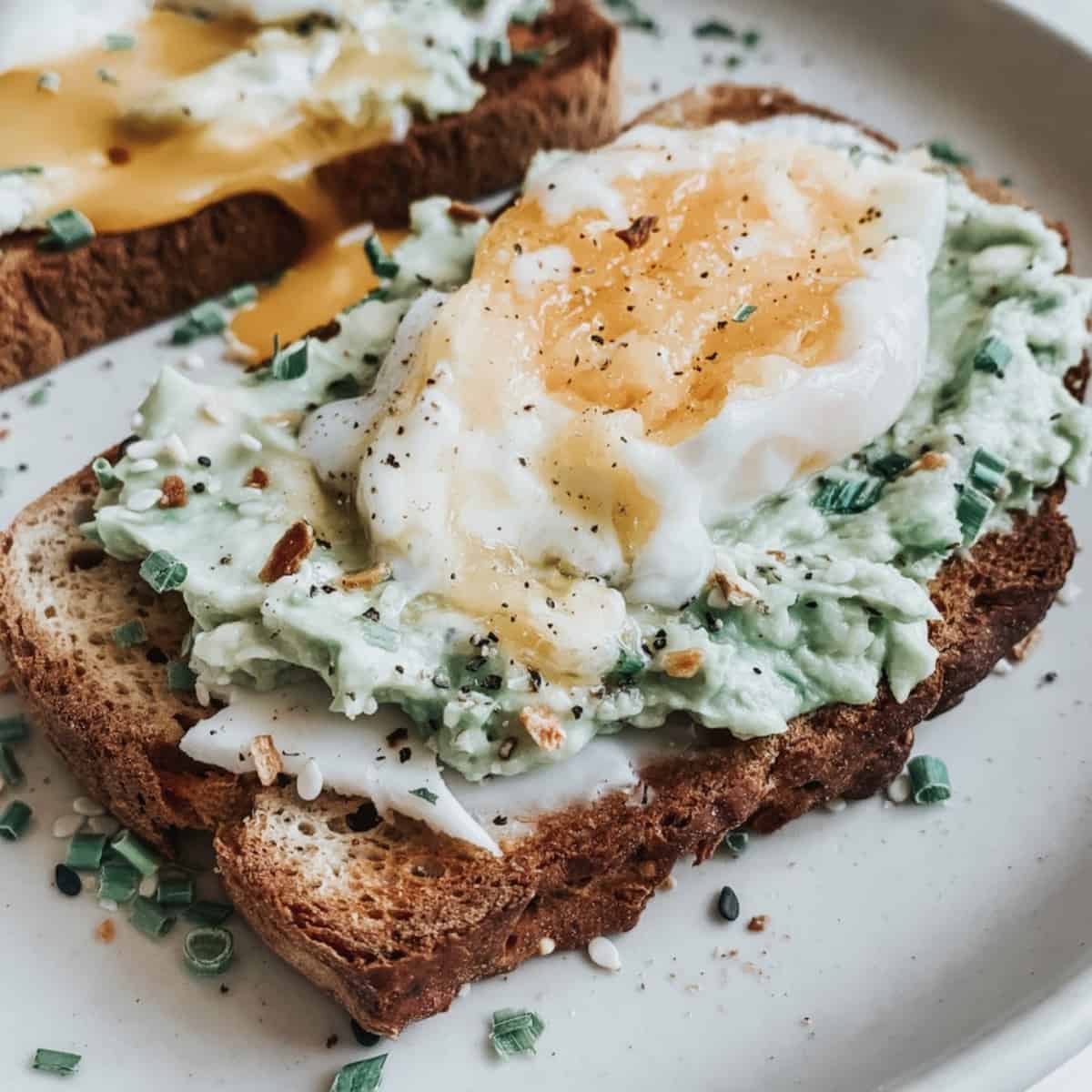 Dill cream cheese and slice avocado toast with a poached egg￼ - bon abbetit