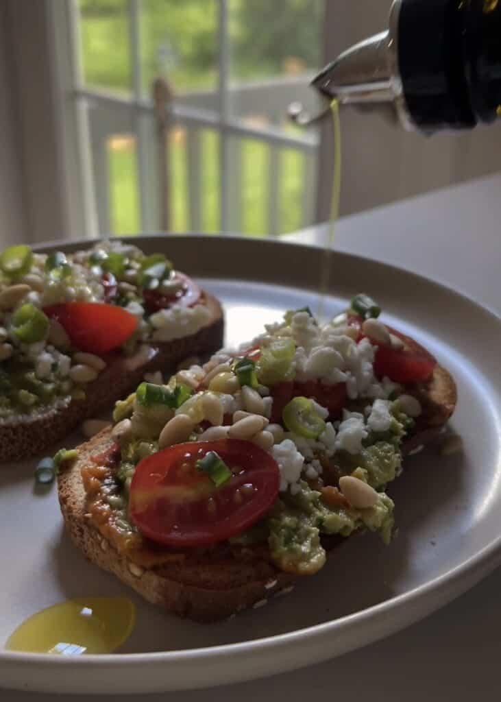 feta avocado toast on gluten free bread with olive oil drizzle