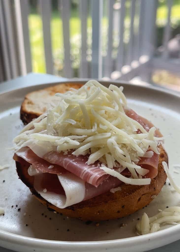 Prosciutto and cheese on a gluten free bagel