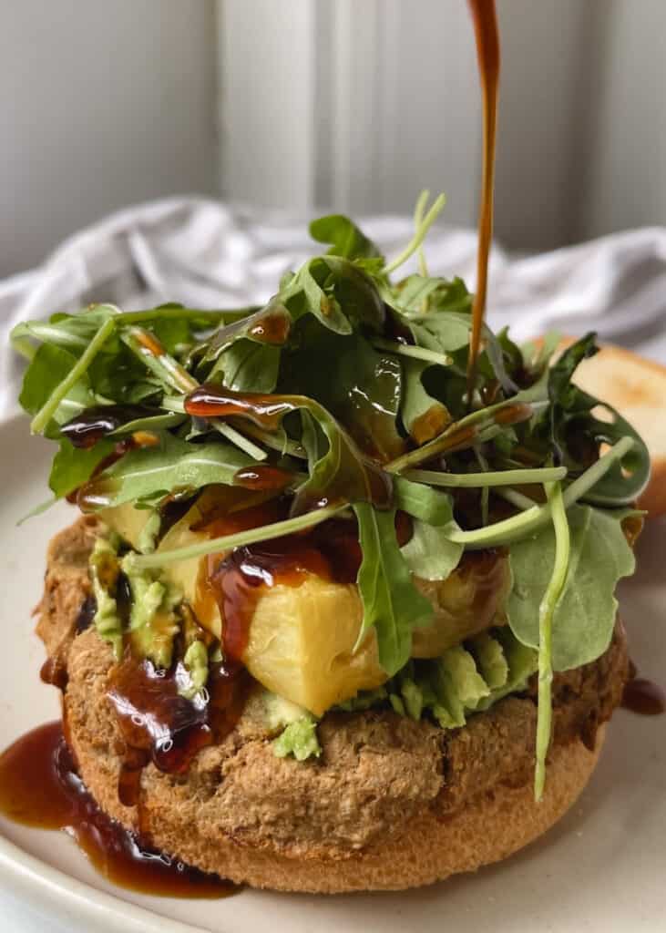 gluten free burger bun with tuna patty and avocado and pineapple and korean bbq sauce