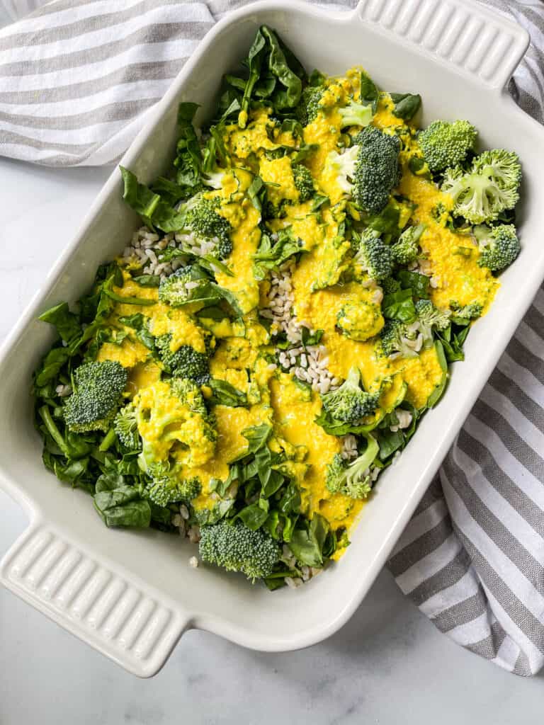 rice and spinach and broccoli in casserole dish