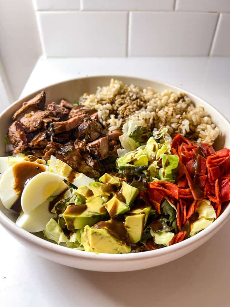 steak grain bowl with balsamic dressing and brown rice