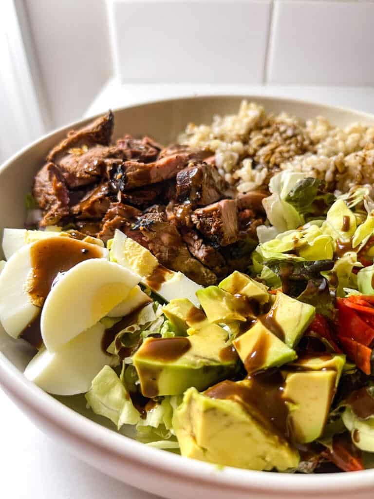 steak grain bowl with balsamic dressing and brown rice