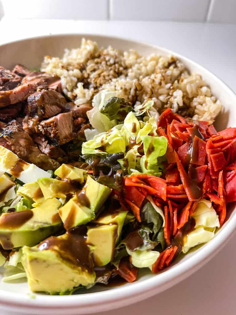 steak grain bowl with balsamic dressing and brown rice