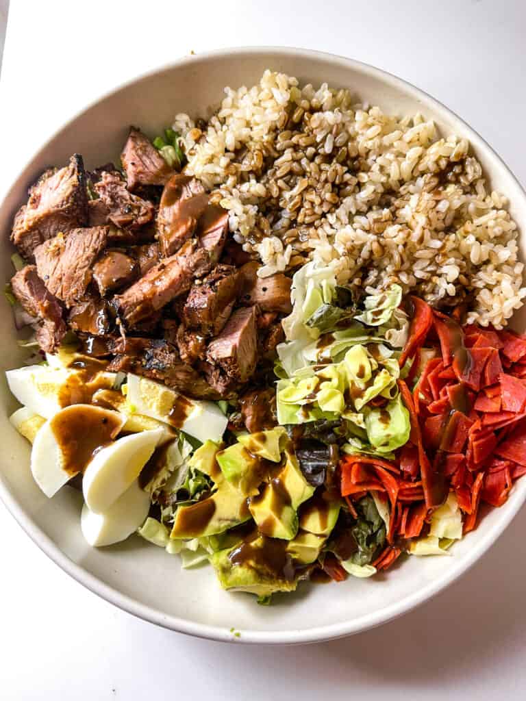 steak grain bowl with balsamic dressing and brown rice