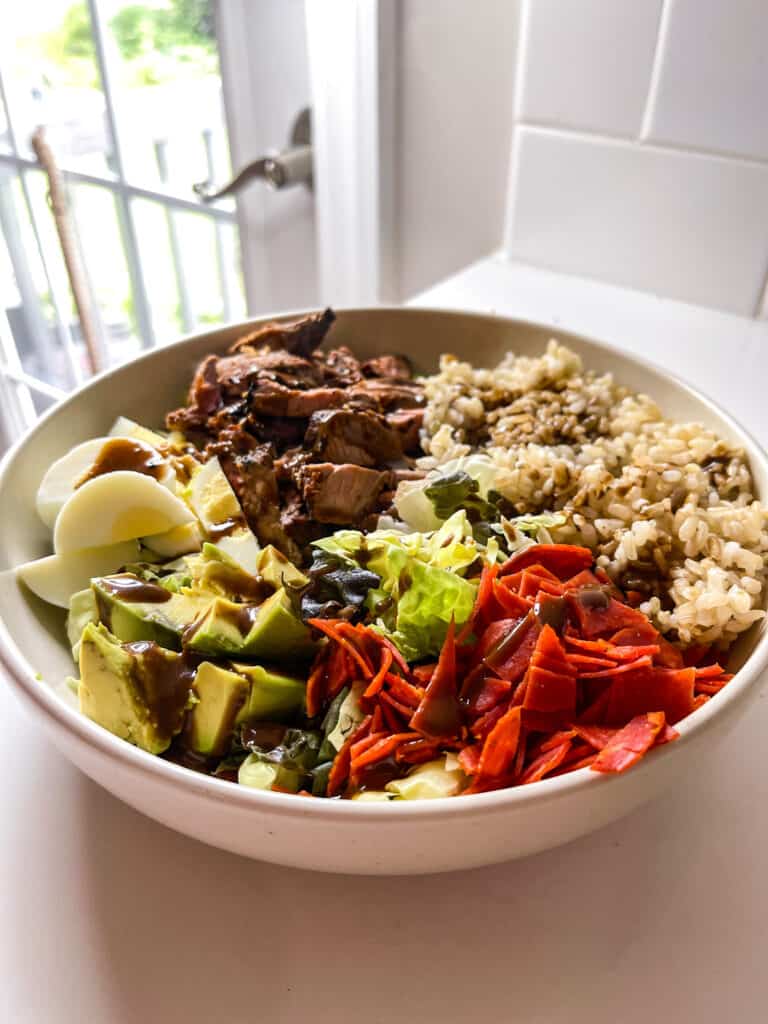 steak grain bowl with balsamic dressing and brown rice