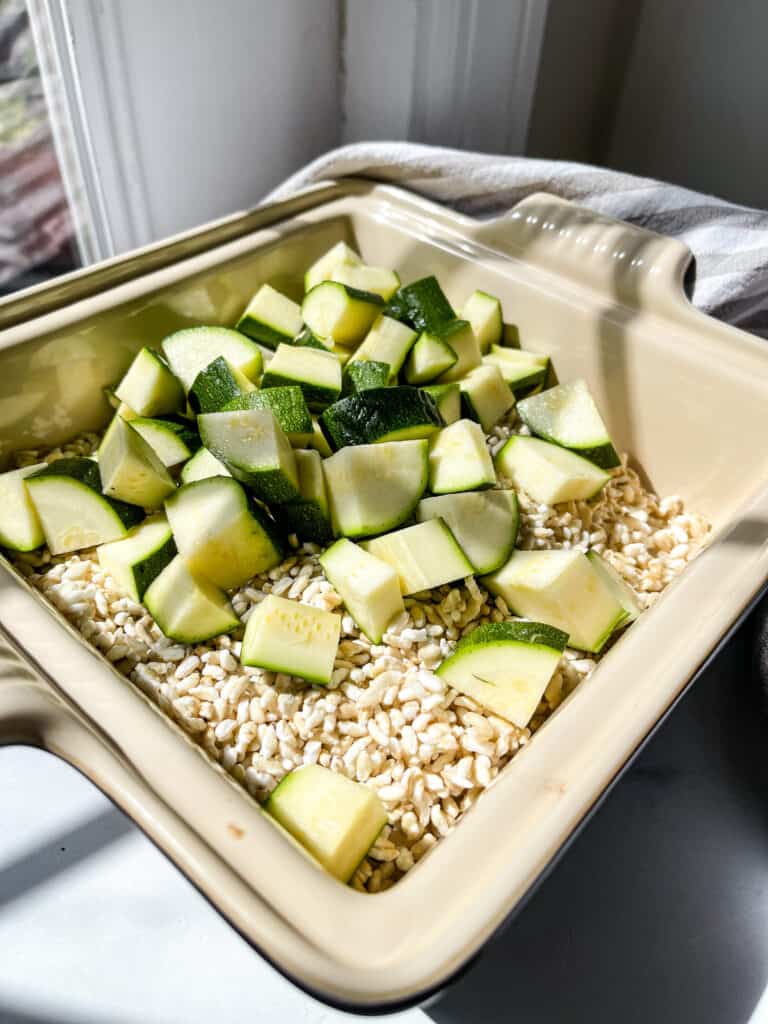 making the dairy free chicken rice casserole with rice and zucchini 