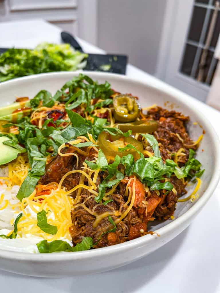 Low carb taco bowls with shredded beef and brown rice