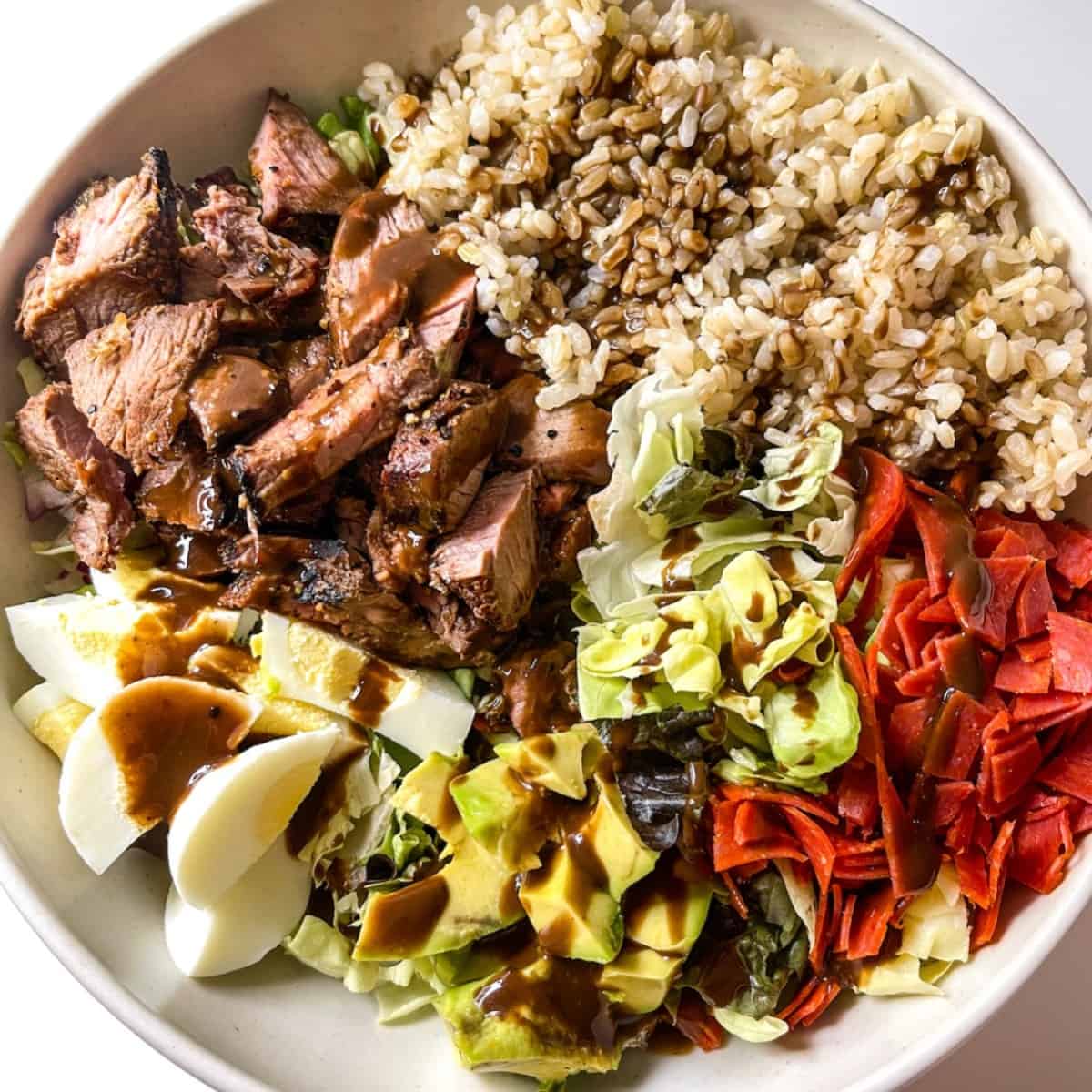 steak grain bowl with balsamic dressing and brown rice