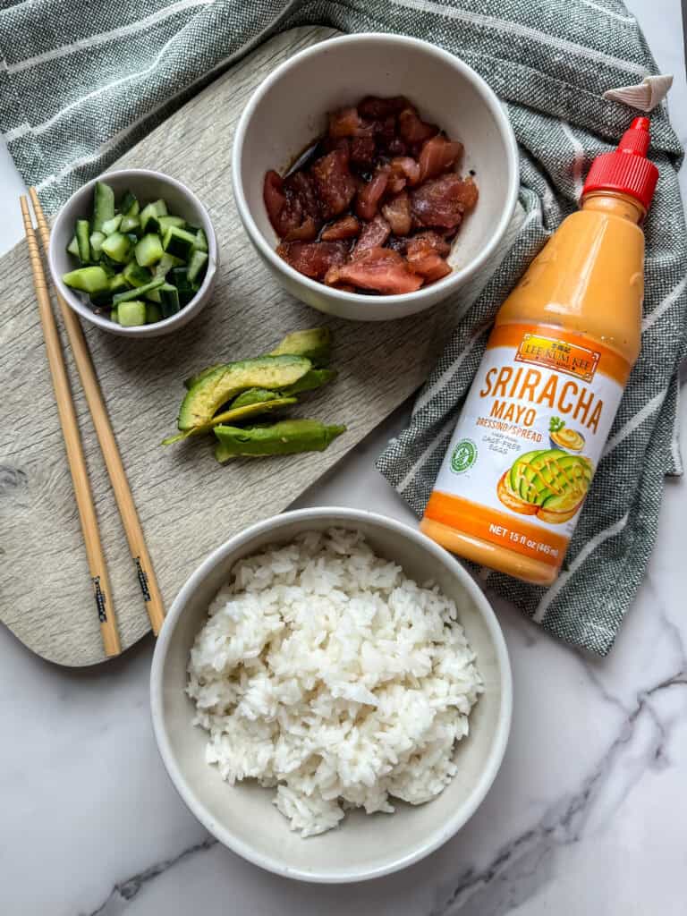 the ingredients laid out to make a poke bowl