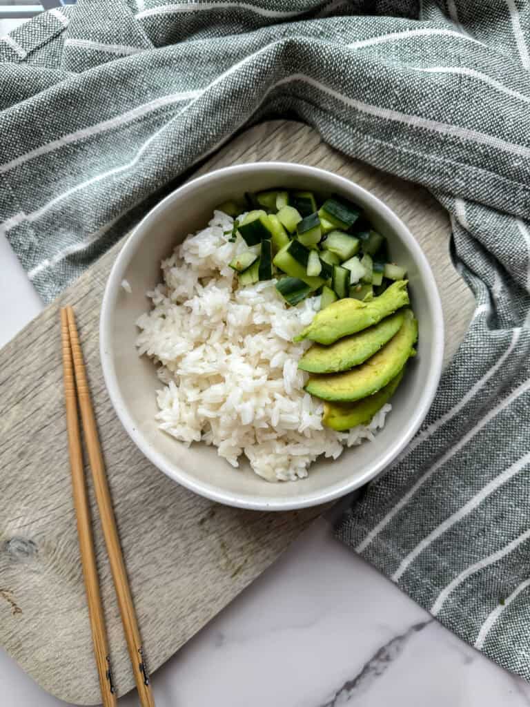 Poke bowl with avocado, cucumber and rice