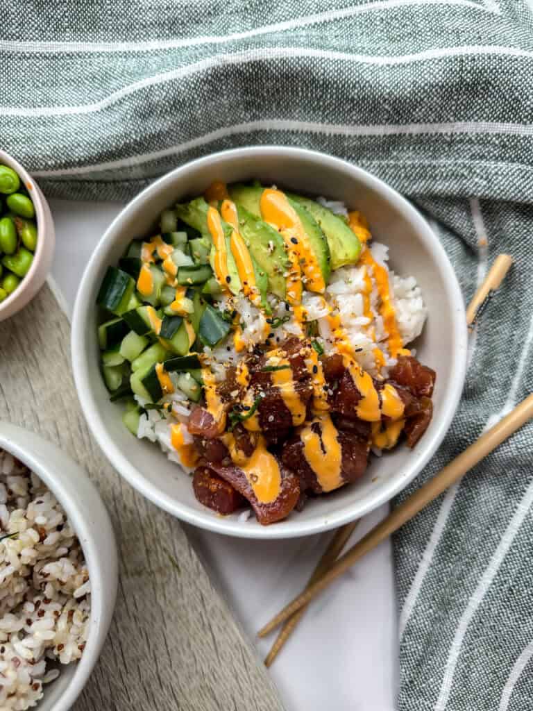 Poke bowl with avocado, tuna, cucumber and a drizzle of spicy mayo