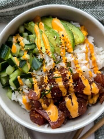 Poke bowl with avocado, tuna, cucumber and a drizzle of spicy mayo