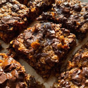 banana oatmeal bars sliced on a parchment lined baking sheet