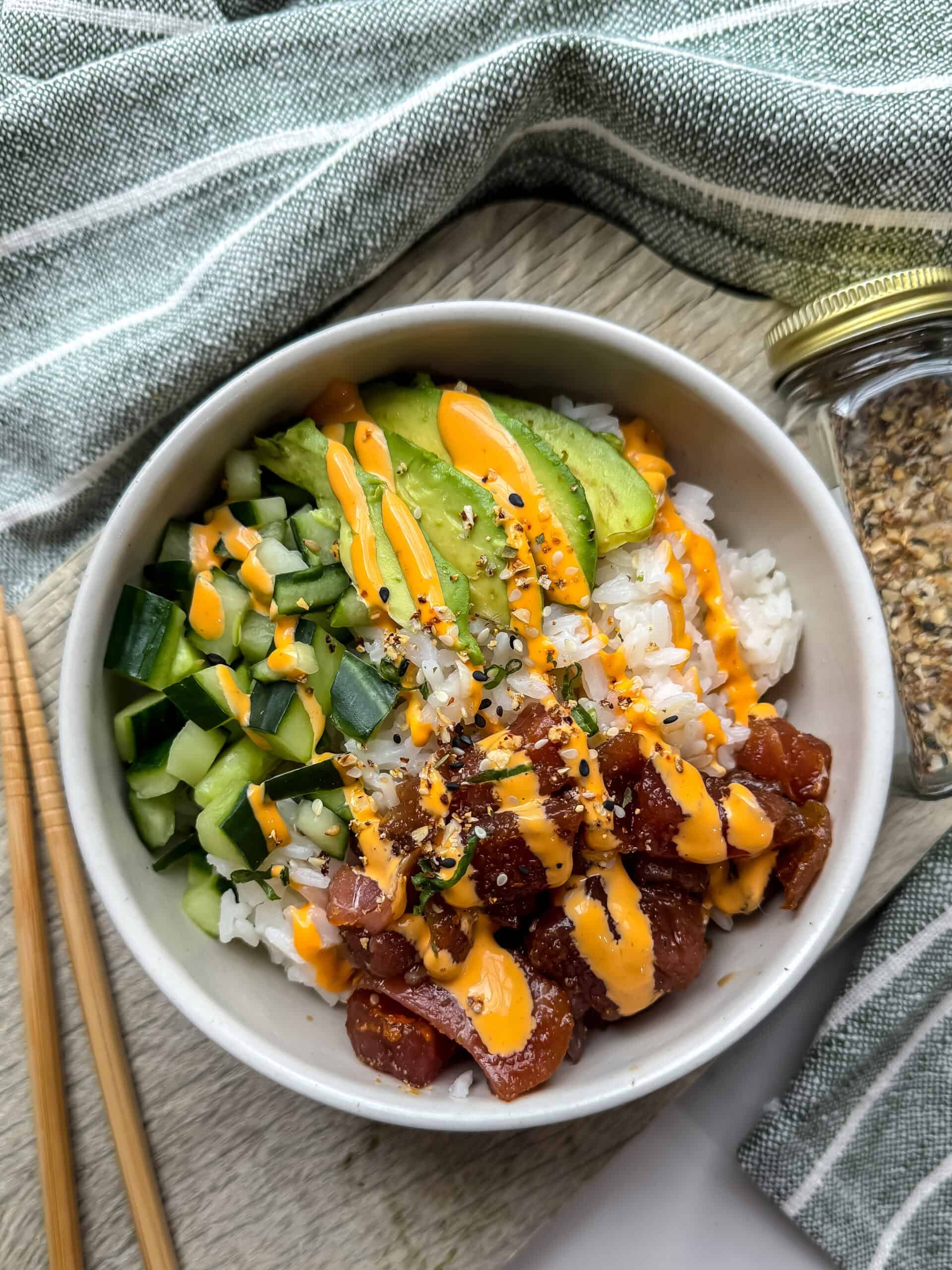 Poke bowl with avocado, tuna, cucumber and a drizzle of spicy mayo
